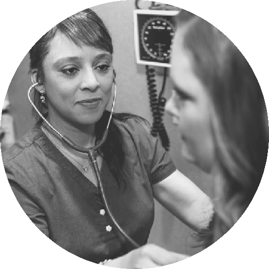 Medical professional with stethoscope checking patient